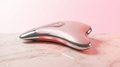 Sculpt device on dewy pink marble — product hero